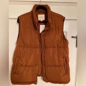 Thread & Supply burnt sienna oversized lightweight puffer vest with pockets.
